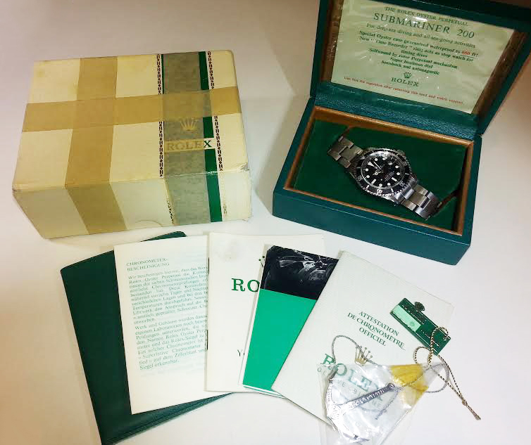 Rolex Red Submariner documentation of authenticity.